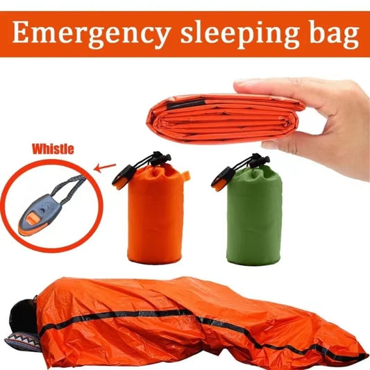 Emergency sleeping bag with whistle feature, shown open and folded, held by a hand.